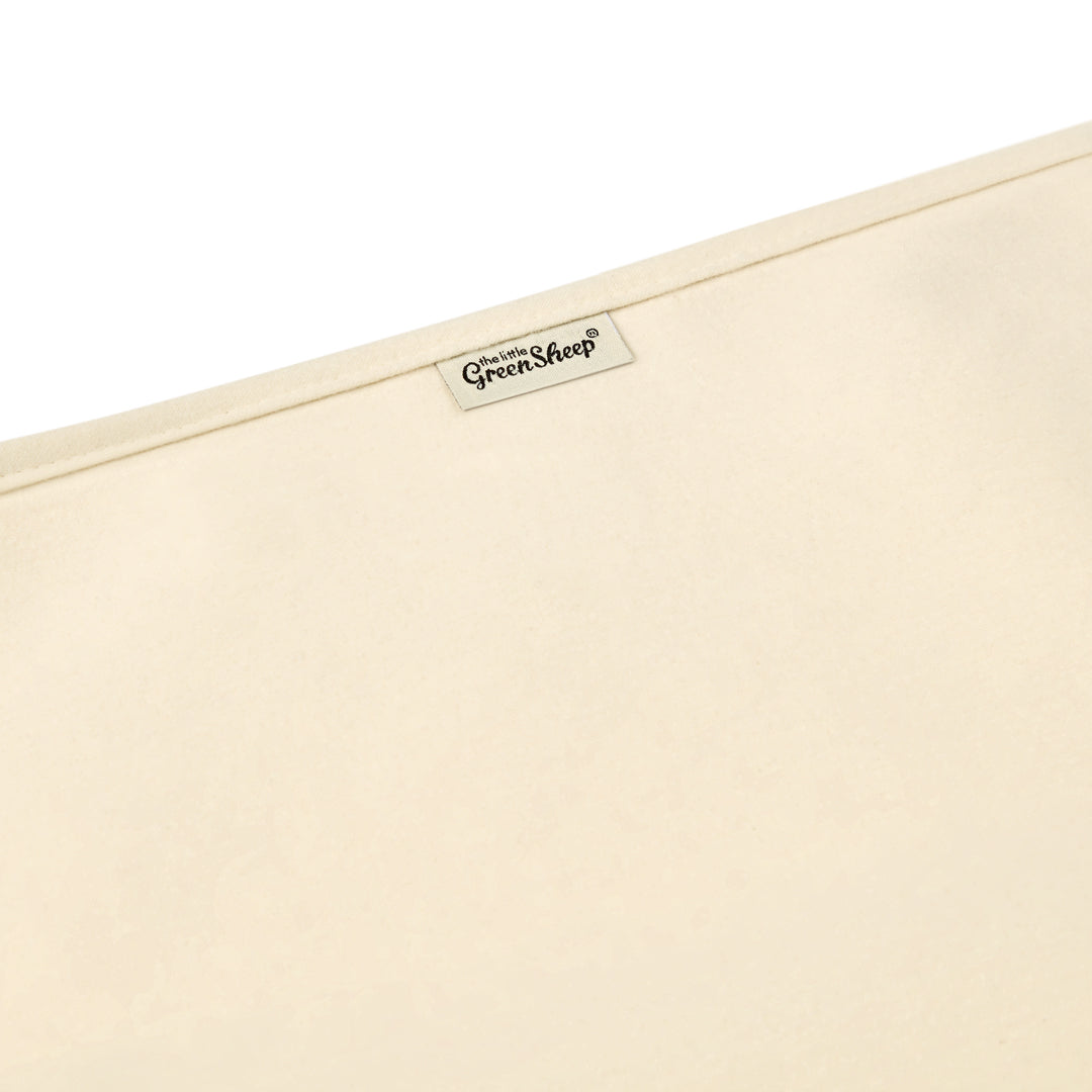 Органічний наматрацник для дитячого ліжечка